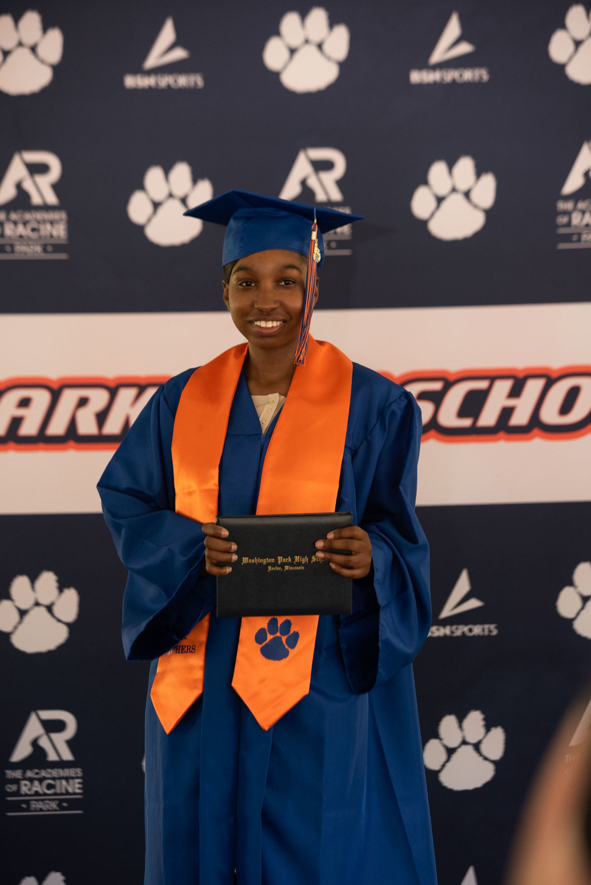 A smiling grad